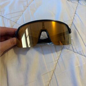Brand new Oakley Sunglasses with Black Frame and Gold Lens